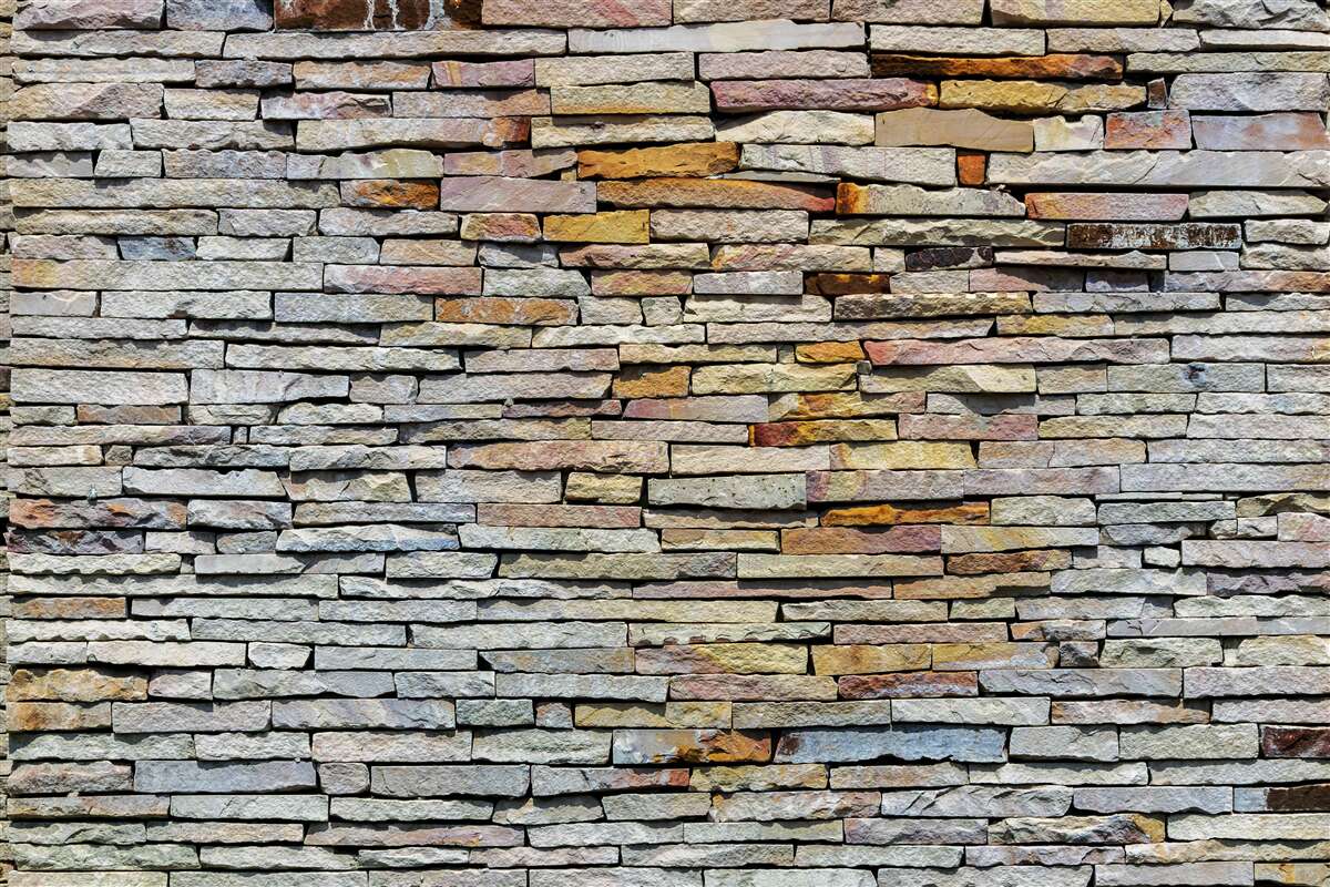 Fototapeta Ściana pokryta kamiennymi pasami