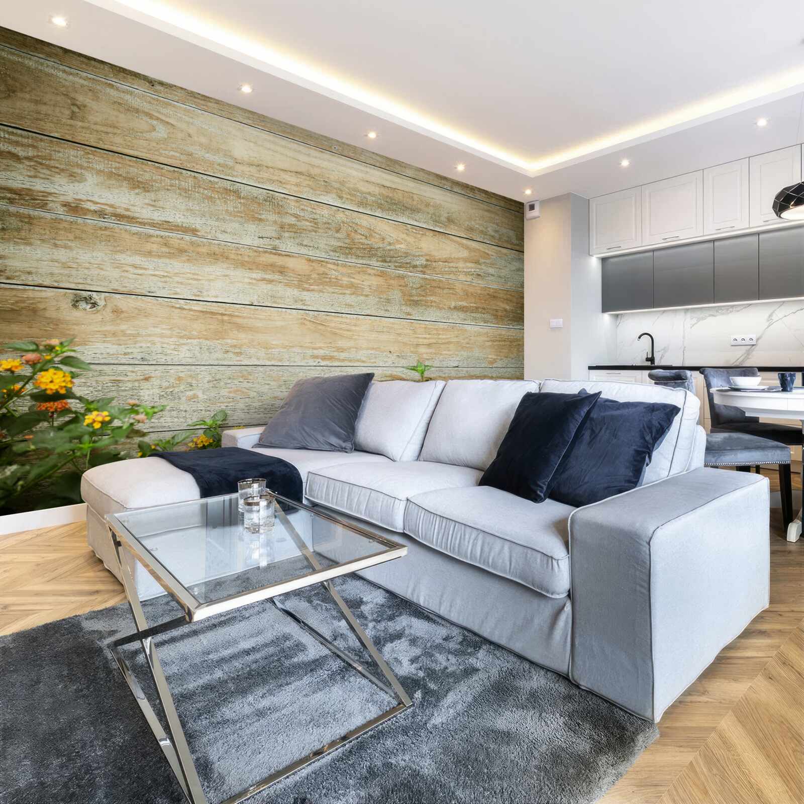 Fototapeta na tle parkietu w otoczeniu zieleni widnieją żółte kwiaty