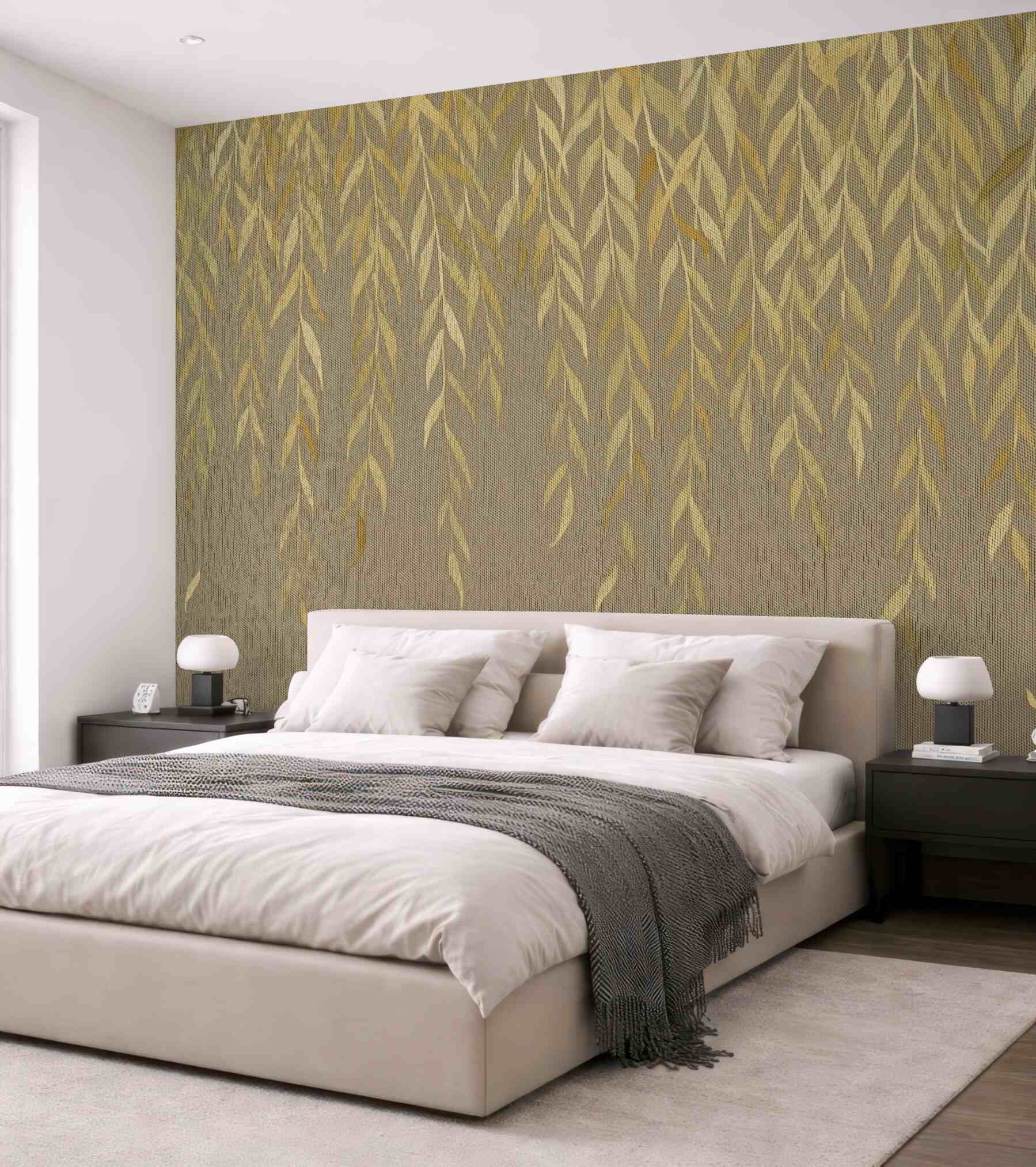 Fototapeta Gałęzie wierzby z liśćmi w odcieniach żółci i zieleni opadające na brązowym płóciennym tle.