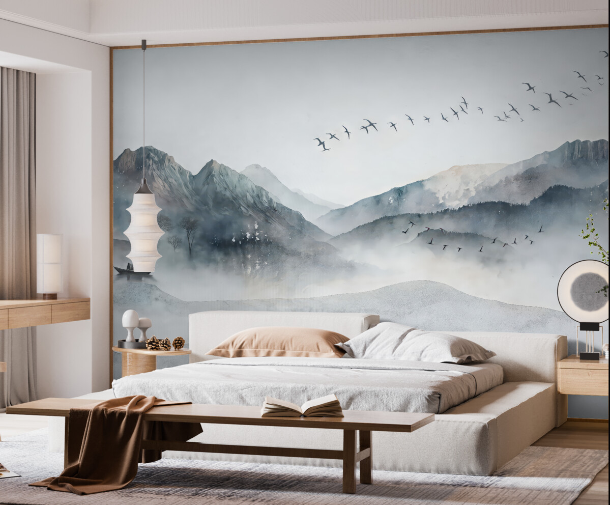 Fototapeta Pejzaż z górami w oddali, z kilkoma drzewami dostrzegalnymi na pierwszym planie, spokojny.