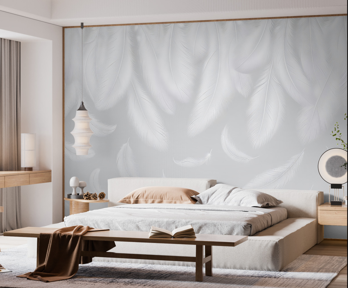 Fototapeta Subtelne białe pióra opadające z góry na przyjemnym szarym tle.