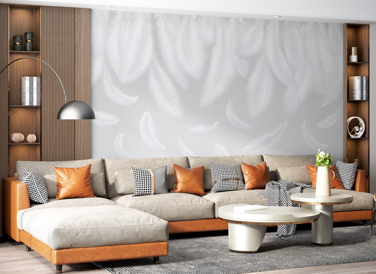 Fototapeta Subtelne białe pióra opadające z góry na przyjemnym szarym tle.