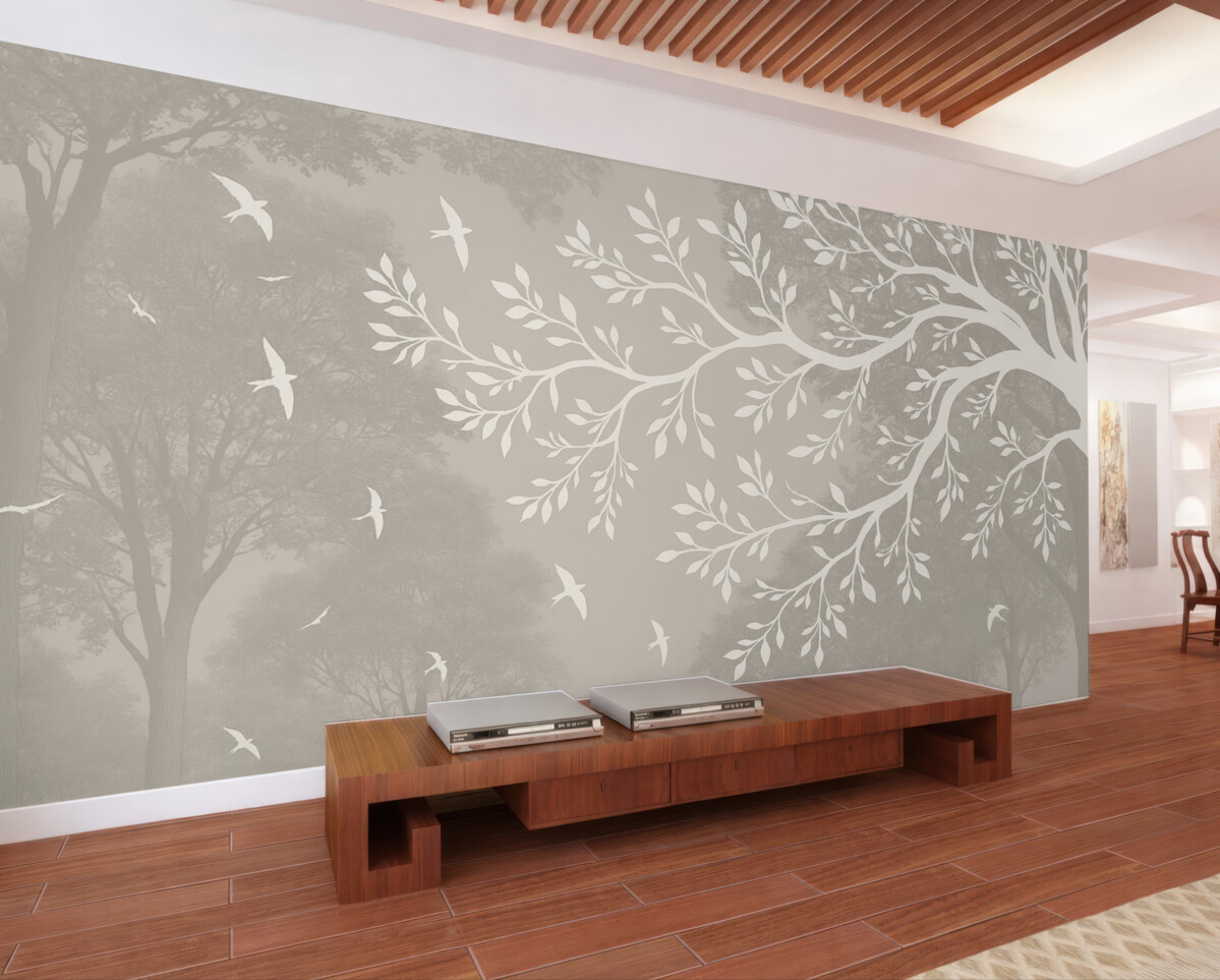 Fototapeta Sylwetka jasnej gałęzi drzewa z ptakami na tle lasu.