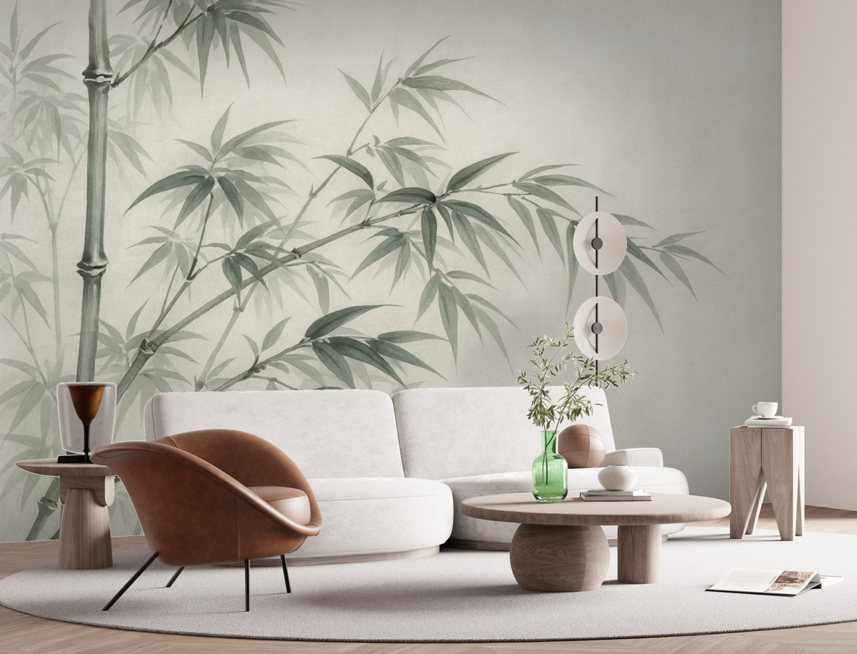 Fototapeta Liście bambusa na jasnym, plamkowanym tle przypominającym akwarelę.