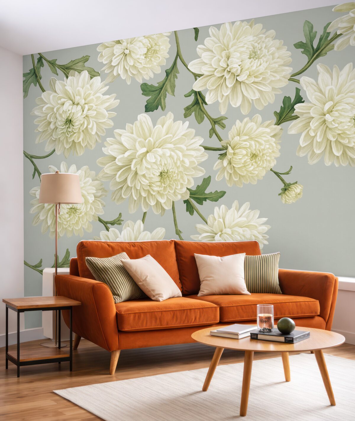 Fototapeta Białe kwiaty chryzantem z zielonymi liśćmi na jasnoszarym tle.