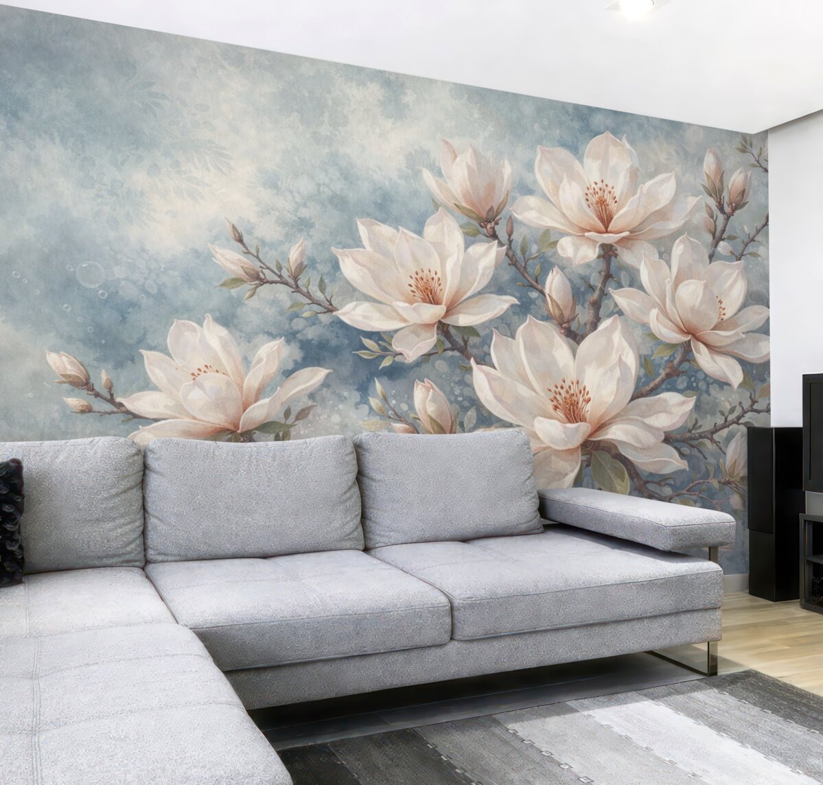 Fototapeta Białe kwiaty magnolii rozwijające się na konarach drzew na delikatnym, rozmytym, strukturalnym niebieskim tle.