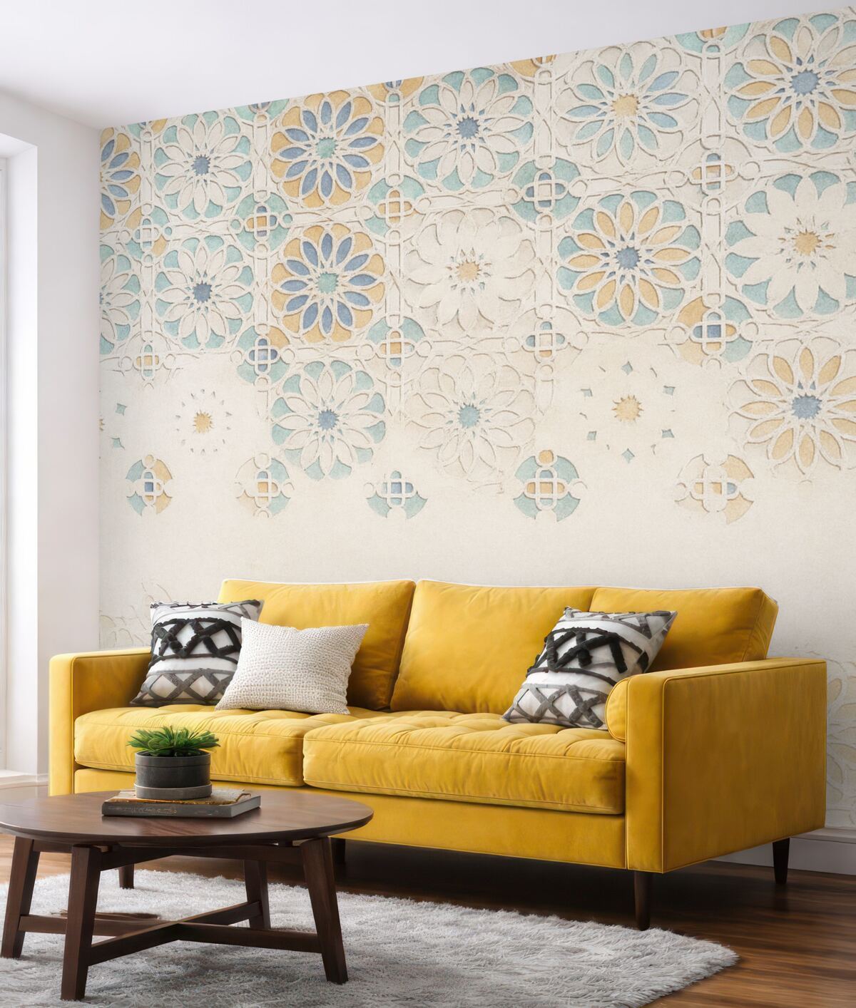 Fototapeta Ściana o fakturze, na której znajduje się powtarzający się motyw złożonych, dekoracyjnych wzorów w tonacjach błękitu, szarości i beżu.