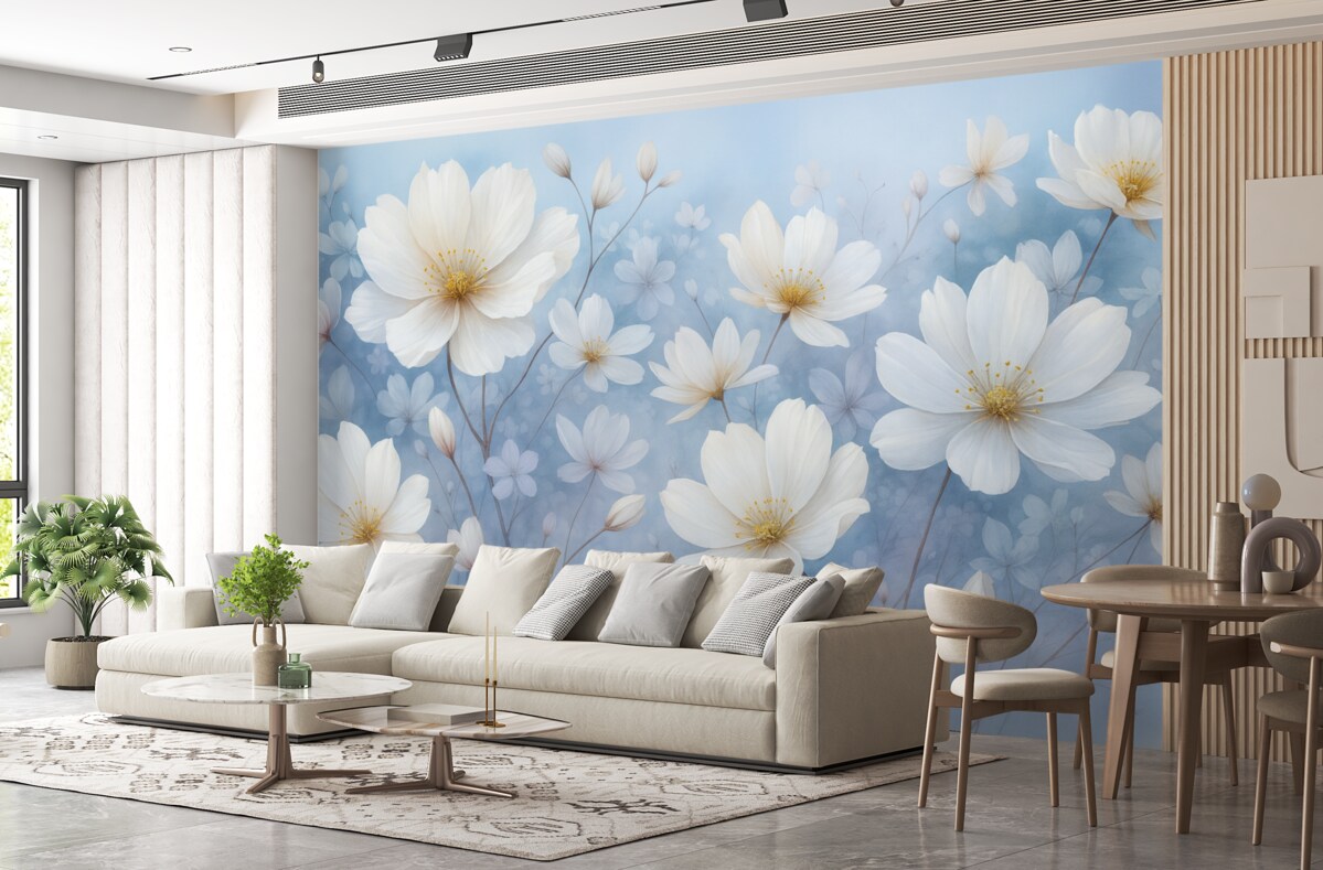 Fototapeta Subtelne białe kwiaty z gładkimi płatkami na rozmytym niebieskim tle, kreujące radosną i lekką atmosferę.