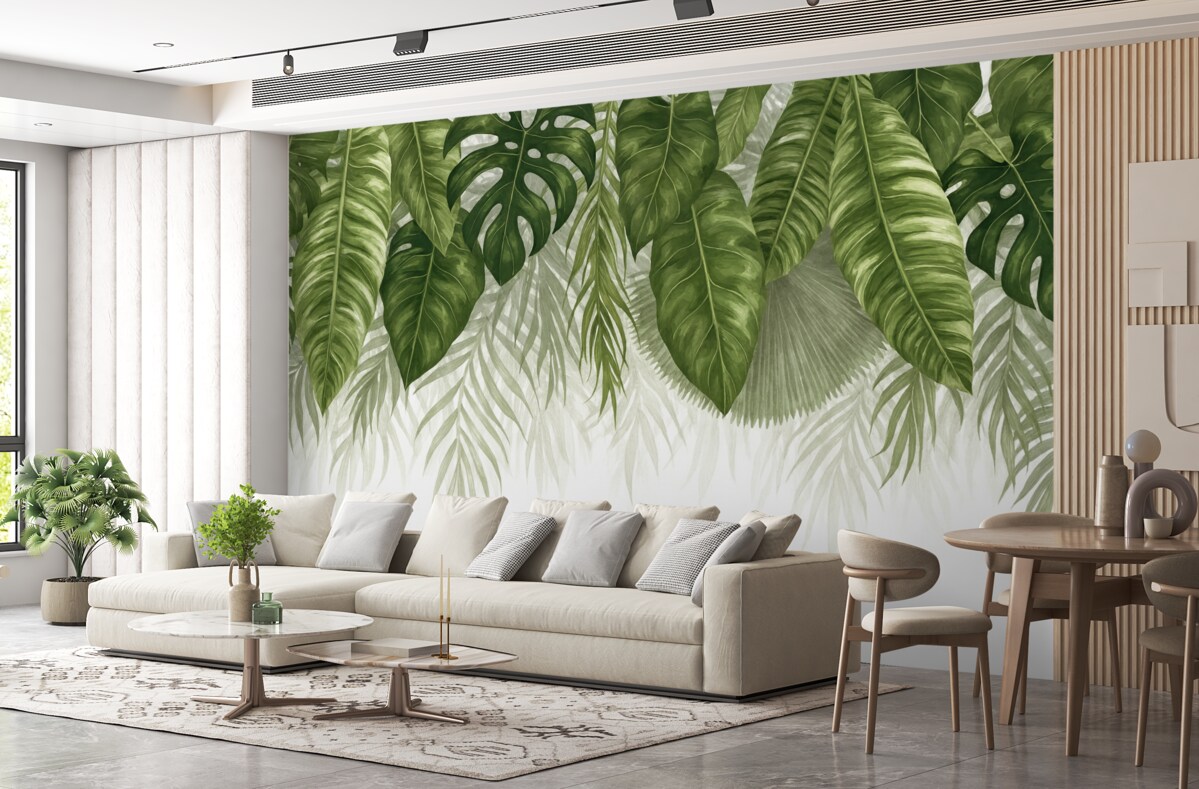 Fototapeta Tropikalne liście w różnych odcieniach zieleni, w tym spore liście monstery i palmowe liście na jasnym tle.